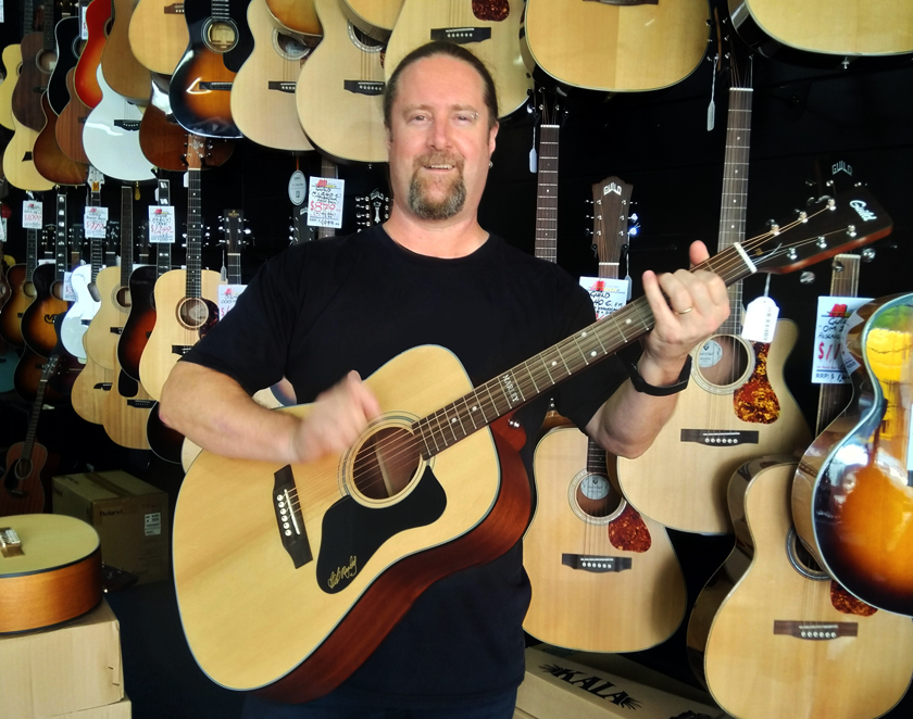 Stewy at Gold Coast Music plays a Guild A-20 Marley 2022 guitar
